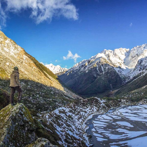 Alpine hunter scanning terrain