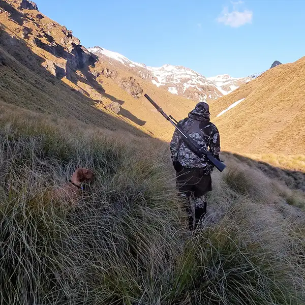 Hunter and his dog in the backcountry