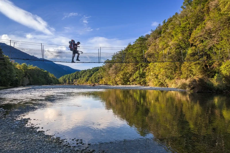 Darryn Pegram | crossing swing bridge over Travers River Nelson Lakes, Nelson 